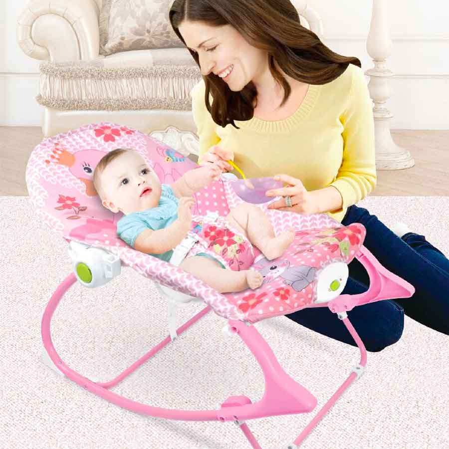 Infant-to-Toddler Rocker with a pink design and attached musical toys.